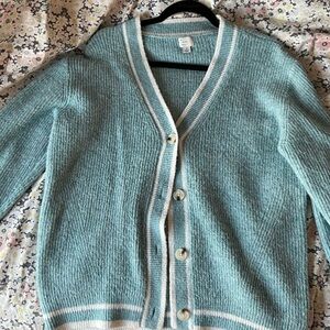 Blue cardigan with white striped accents